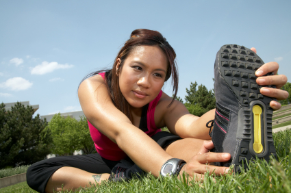 Athletic woman stretches before a run
